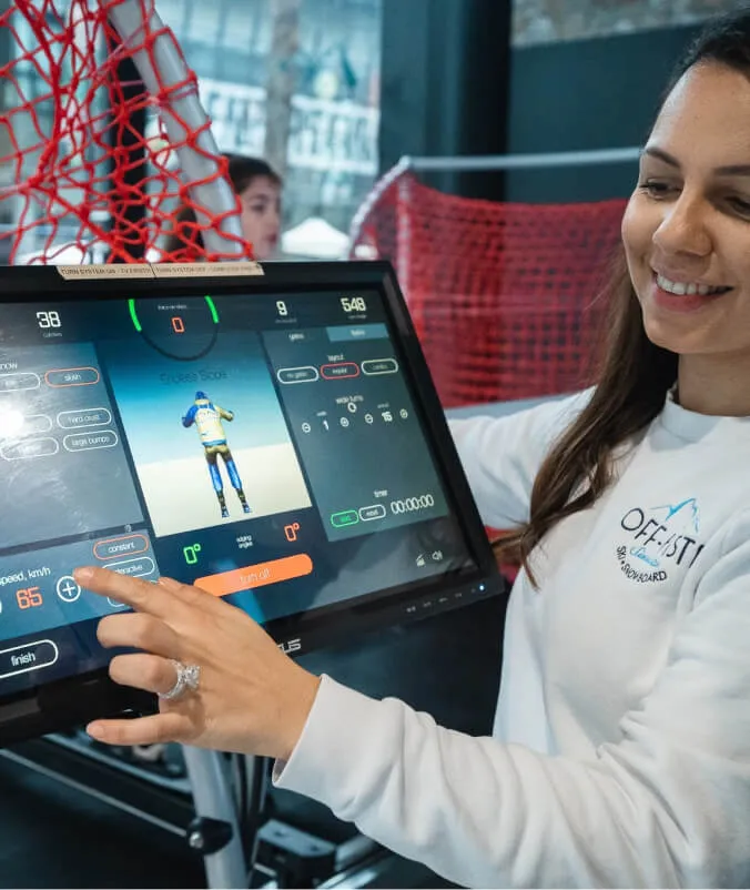 A guest using the SkyTechSport simulator touchscreen at a venue
