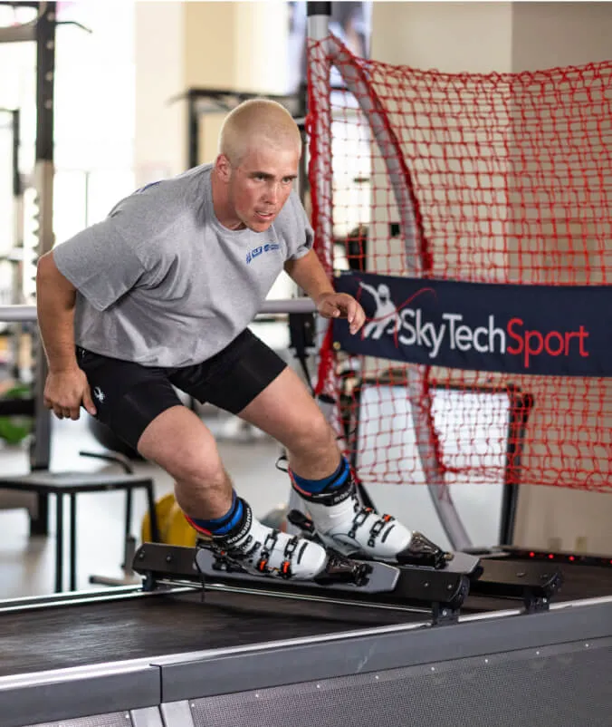 An athlete training on a SkyTechSport simulator at a venue