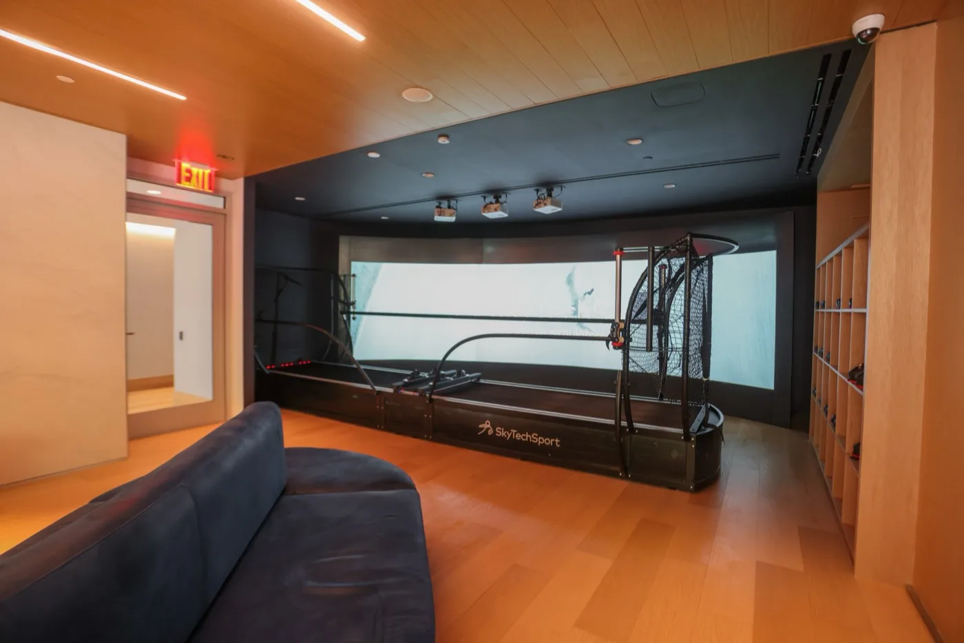 SkyTechSport ski simulator in a luxury home recreation room